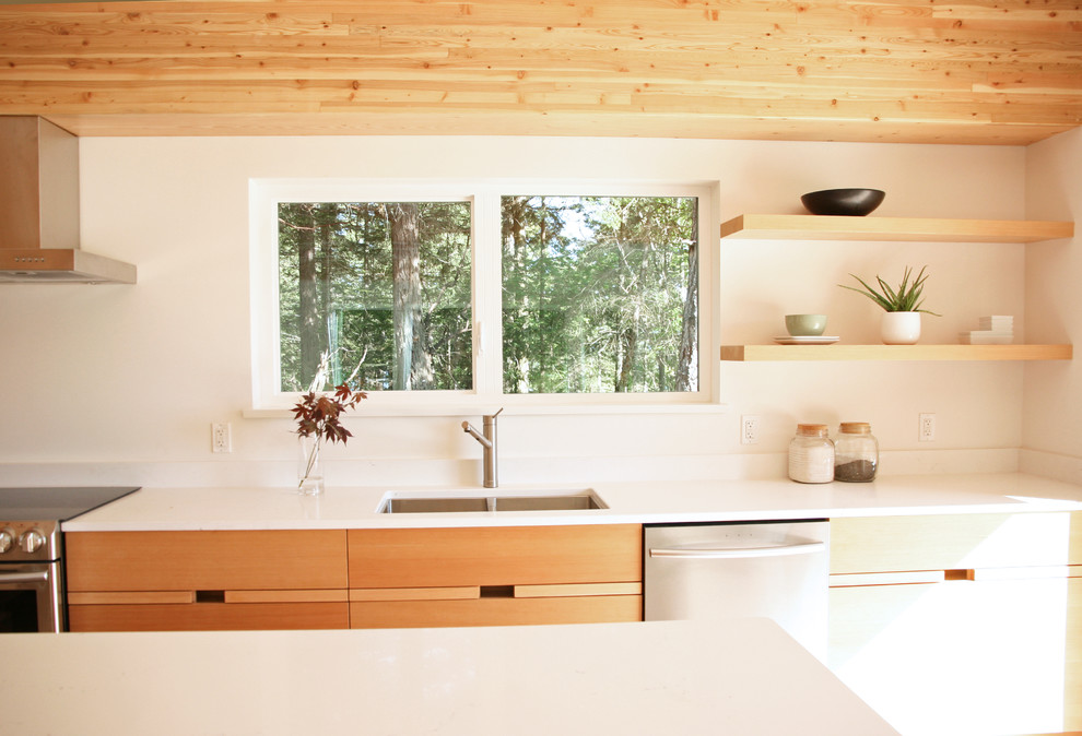 Photo of a mid-sized modern l-shaped eat-in kitchen in Vancouver with an undermount sink, flat-panel cabinets, medium wood cabinets, stainless steel appliances, light hardwood floors, with island, quartzite benchtops and beige floor.