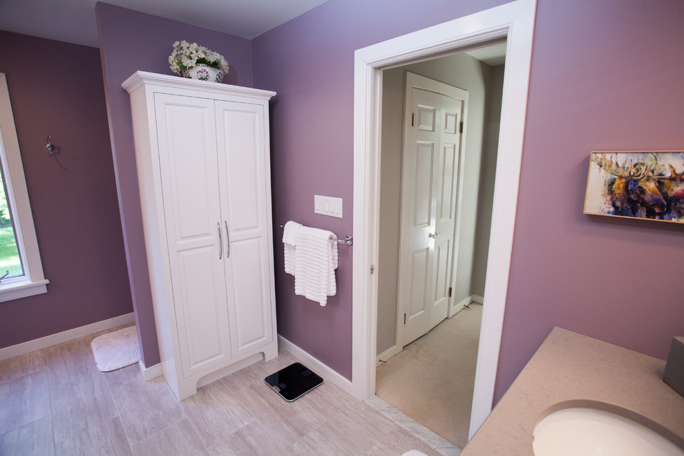 Design ideas for a mid-sized transitional master bathroom in Philadelphia with raised-panel cabinets, white cabinets, an open shower, a two-piece toilet, gray tile, ceramic tile, purple walls, ceramic floors, an undermount sink and engineered quartz benchtops.