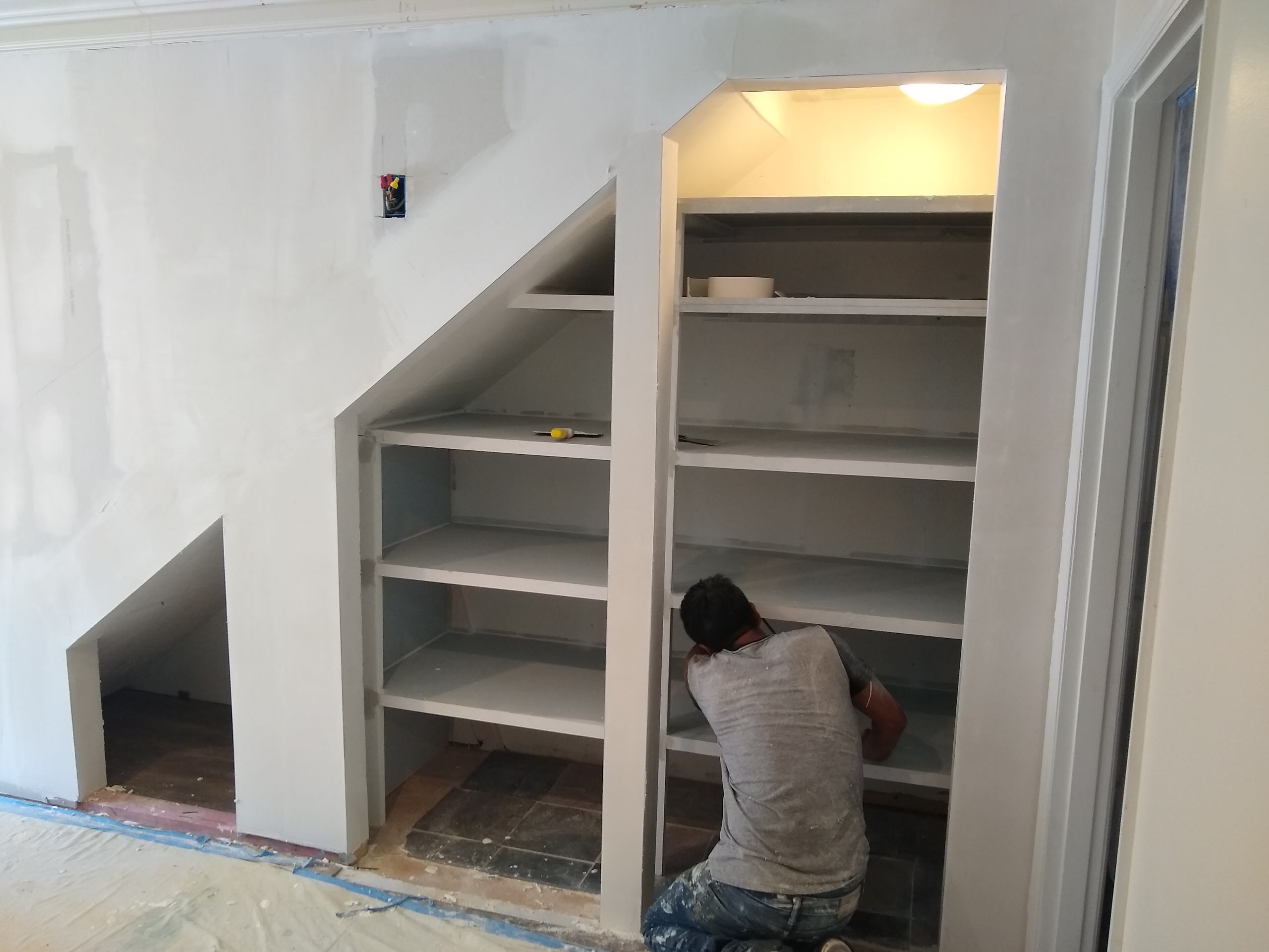 Build Closet with Sliding Barn Doors Under Stairway