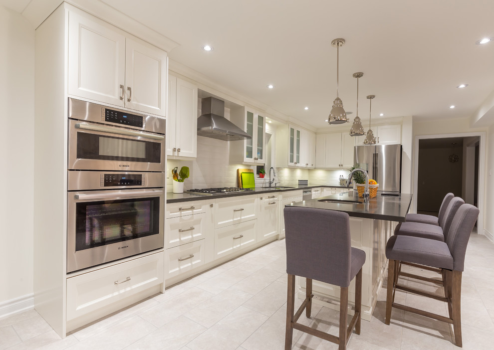 Example of a transitional kitchen design in Toronto