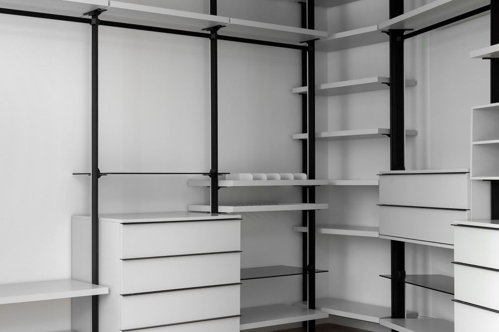 Photo of a large modern gender neutral walk-in wardrobe in Austin with open cabinets, white cabinets, medium hardwood flooring, brown floors and a drop ceiling.