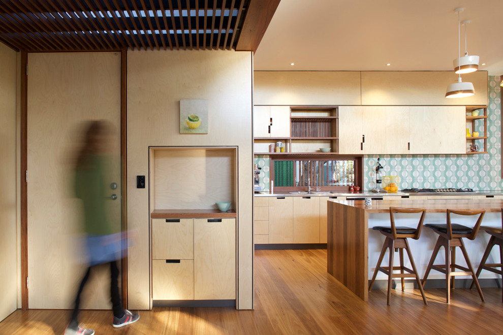 Mid-sized contemporary front door in Brisbane with light hardwood floors, a single front door and a light wood front door.