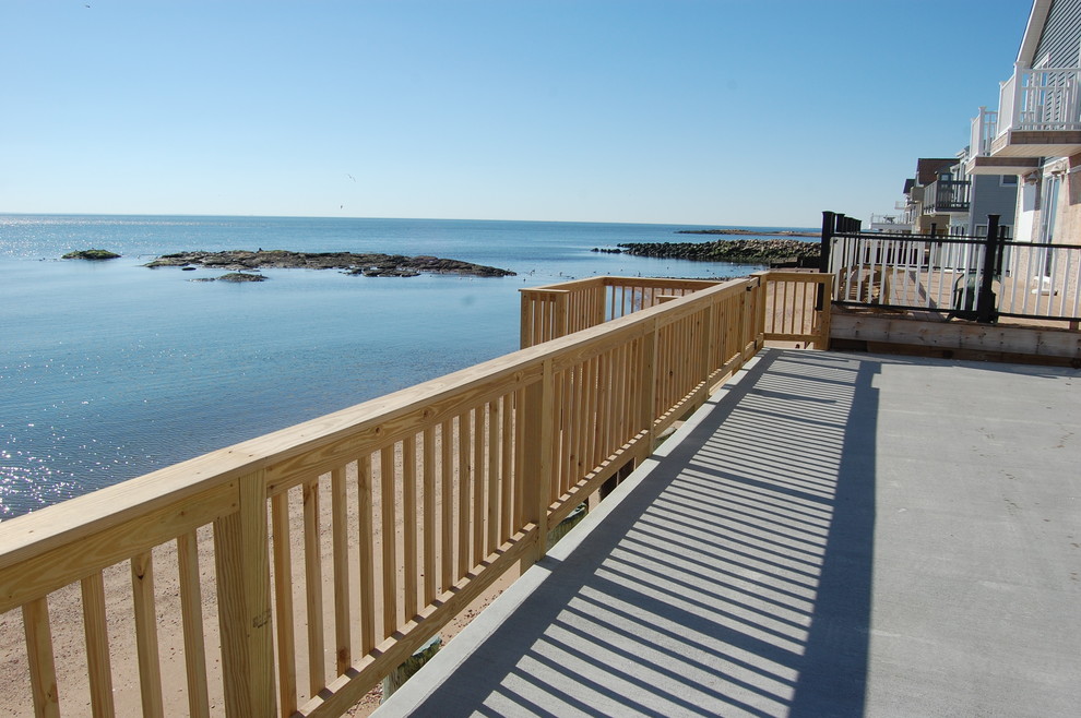 Large two-story and backyard vinyl yellow deck photo in Bridgeport with no cover
