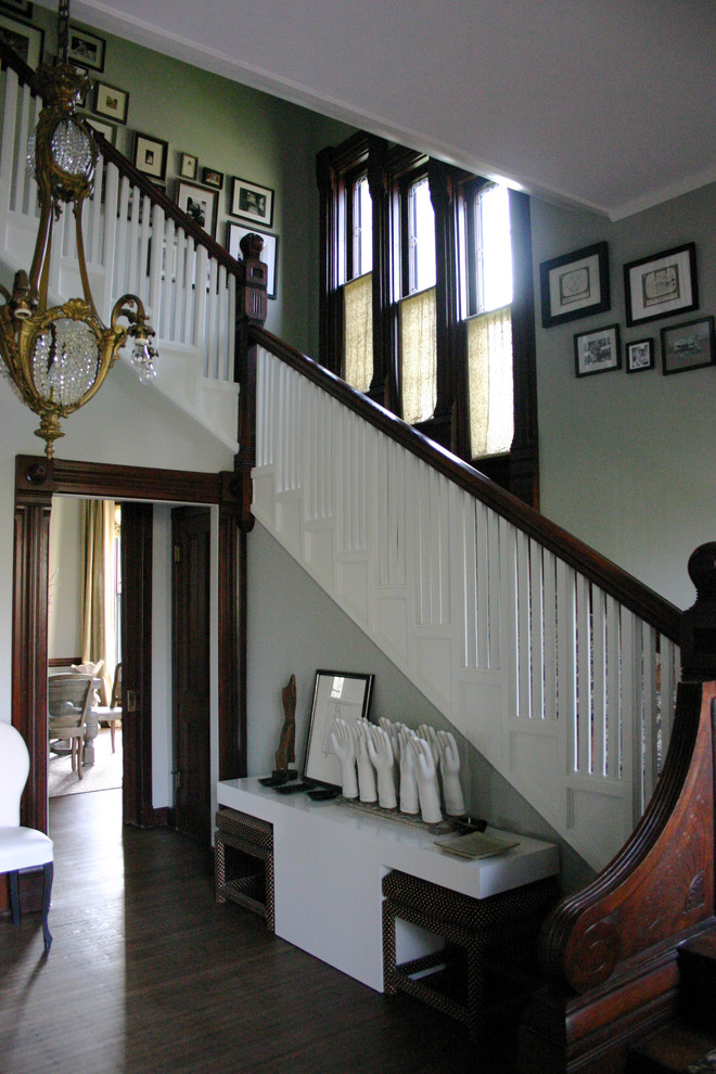 Inspiration for a traditional staircase in Chicago with wood railing.