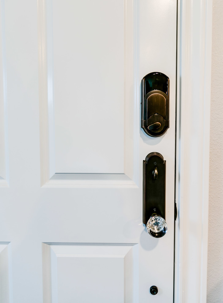 Example of a mid-sized transitional front door design in Austin with beige walls and a white front door