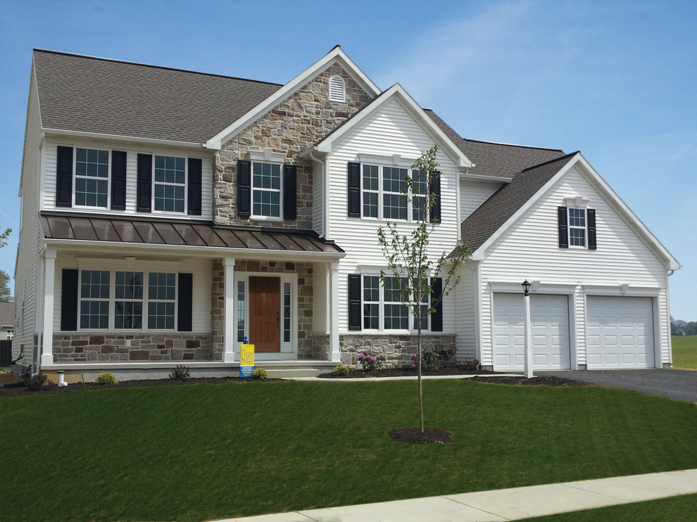 Mid-sized elegant two-story white home design photo