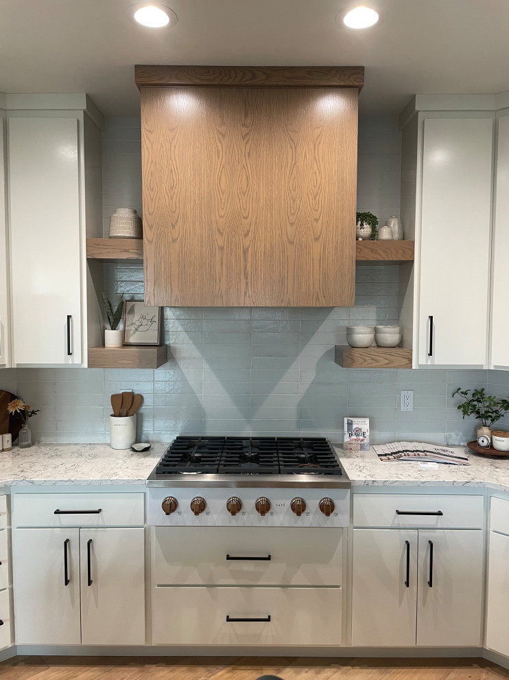 Inspiration for a scandinavian kitchen remodel with flat-panel cabinets and an island