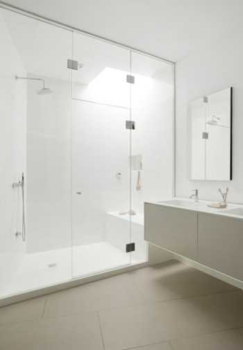Inspiration for a modern bathroom in Boston with flat-panel cabinets, beige cabinets, an alcove shower, white walls, ceramic floors, an integrated sink, beige floor, a hinged shower door, a shower seat, a double vanity and a floating vanity.