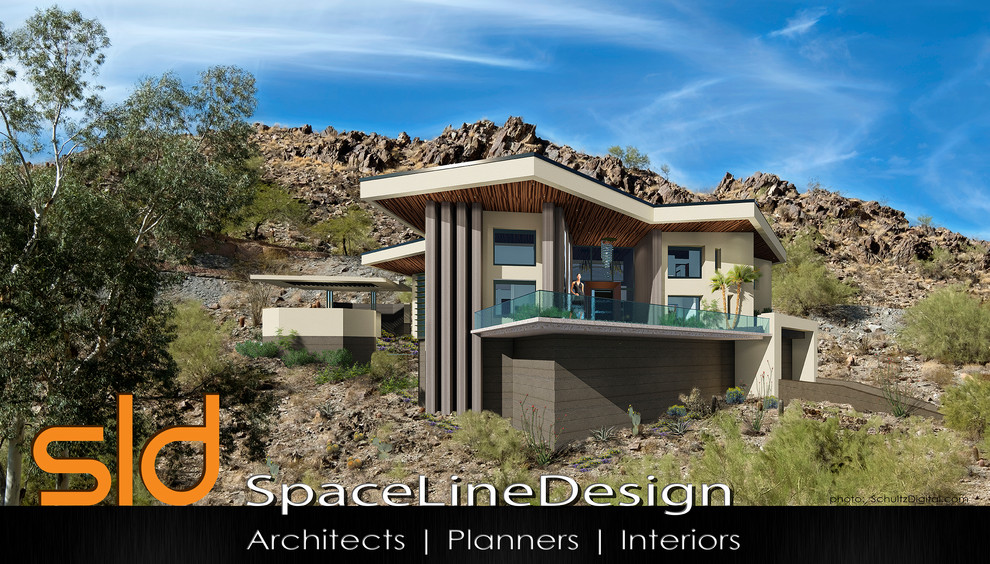 Inspiration for a mid-sized contemporary house exterior in Phoenix.