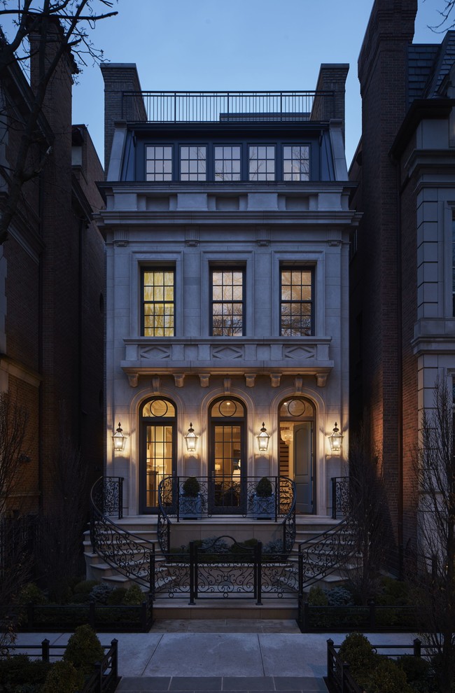 Inspiration for an expansive traditional three-storey beige exterior in Chicago with stone veneer and a flat roof.