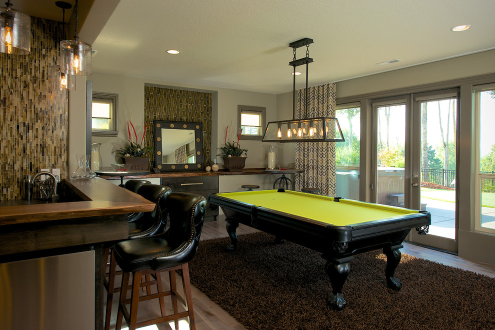 Transitional family room in Vancouver with a game room.