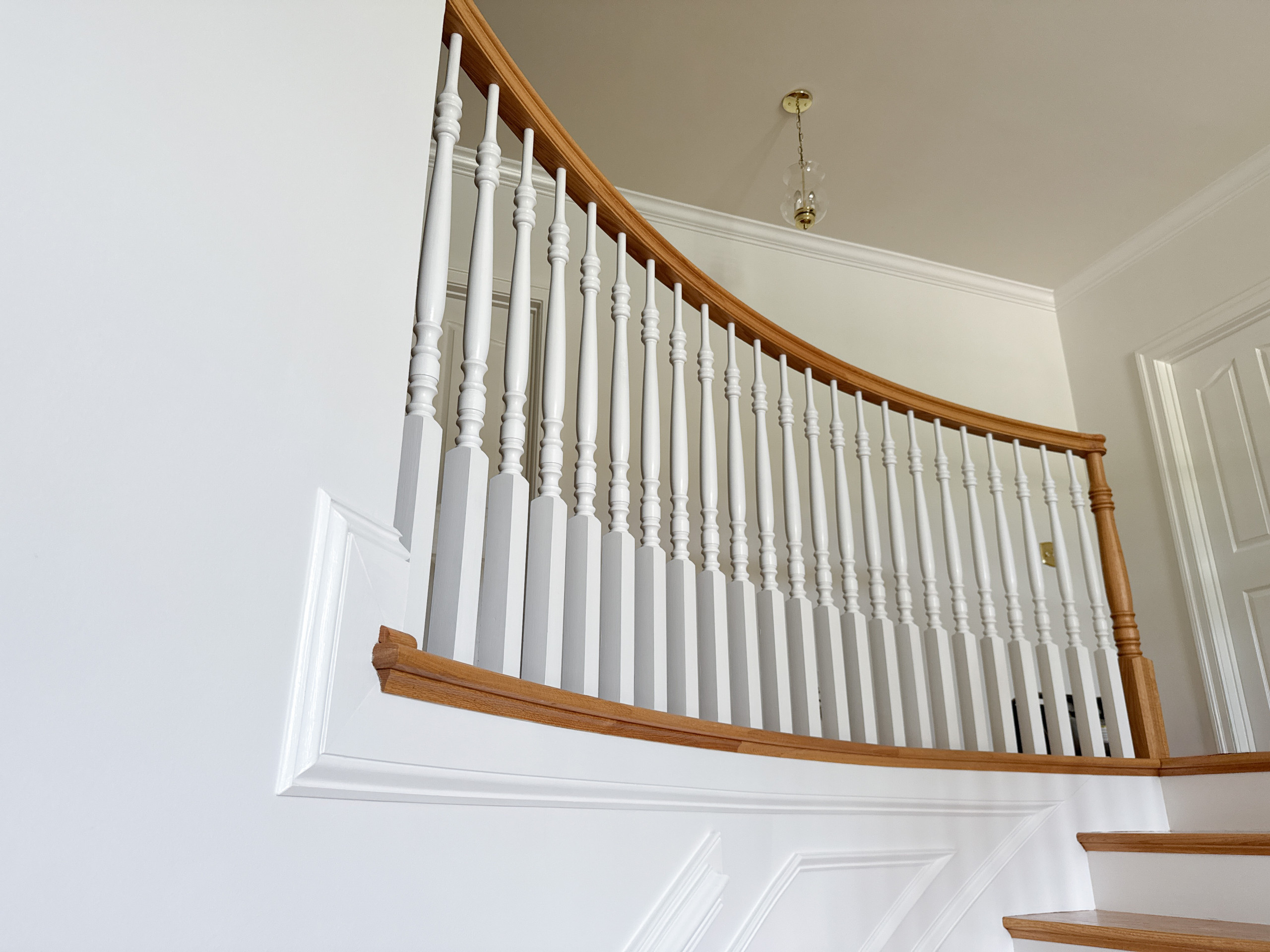 Project #161 | Curved Red Oak Foyer Staircase, 26 Years Later