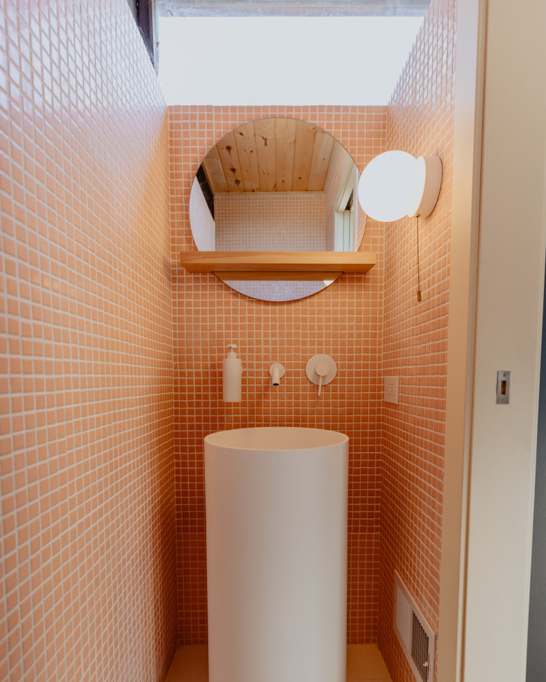 Photo of a small midcentury cloakroom in San Francisco with pink tiles and ceramic tiles.