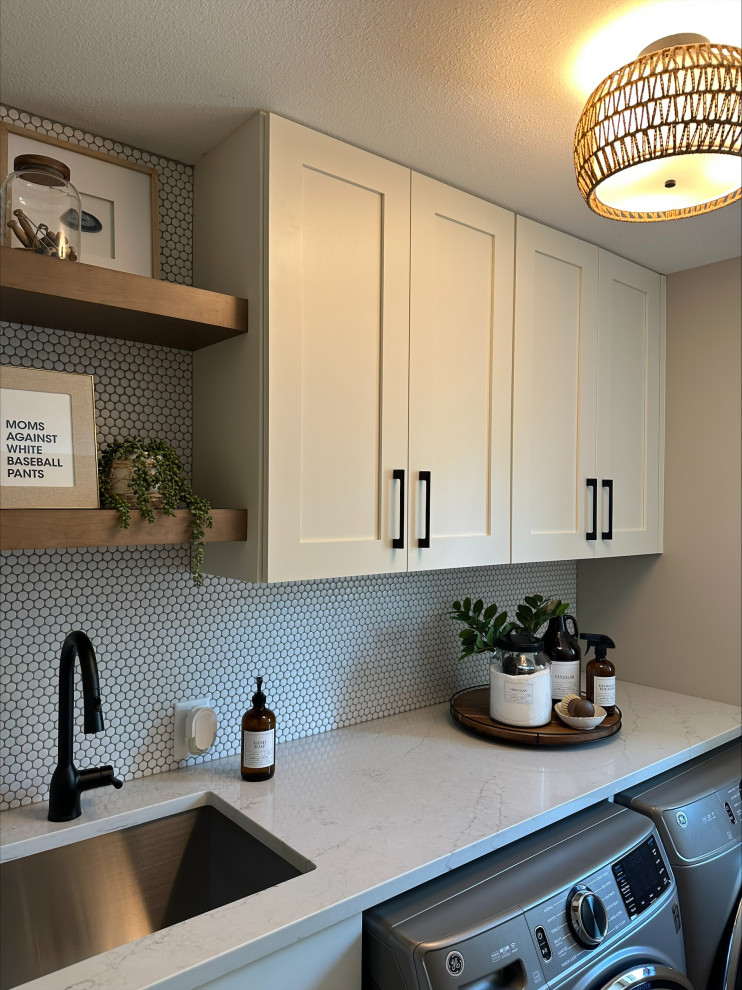 Photo of a medium sized classic single-wall utility room in Other with a submerged sink, shaker cabinets, white cabinets, engineered stone countertops and a side by side washer and dryer.