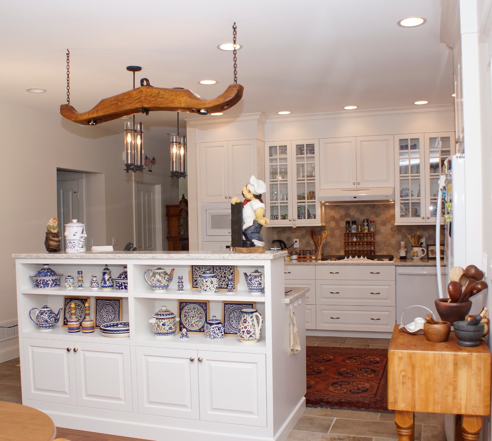 Inspiration for a mid-sized transitional u-shaped porcelain tile eat-in kitchen remodel with an undermount sink, flat-panel cabinets, white cabinets, granite countertops, stone tile backsplash, stainless steel appliances, a peninsula and multicolored backsplash