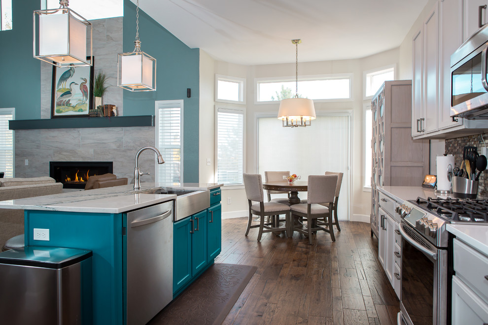 Inspiration for a mid-sized transitional l-shaped dark wood floor and brown floor open concept kitchen remodel in Denver with a farmhouse sink, shaker cabinets, white cabinets, marble countertops, metallic backsplash, matchstick tile backsplash, paneled appliances, an island and gray countertops