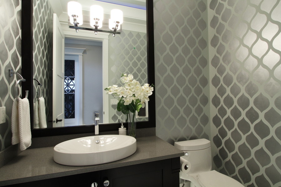 Inspiration for a contemporary powder room in Vancouver with grey benchtops.