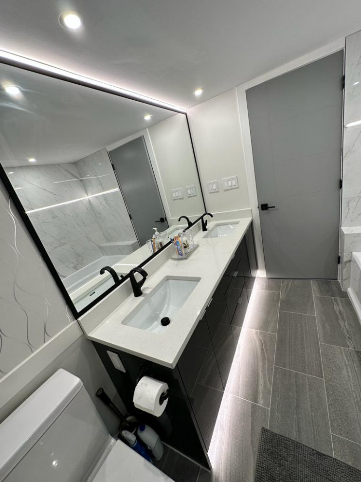 Photo of a mid-sized modern master bathroom in Vancouver with flat-panel cabinets, a drop-in tub, white tile, porcelain tile, wood-look tile, an undermount sink, engineered quartz benchtops, grey floor, a hinged shower door, white benchtops, a niche, a single vanity, a floating vanity and wallpaper.