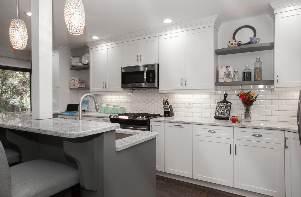Design ideas for a large transitional l-shaped eat-in kitchen in Philadelphia with a single-bowl sink, recessed-panel cabinets, white cabinets, quartzite benchtops, white splashback, ceramic splashback, stainless steel appliances, ceramic floors, with island and brown floor.