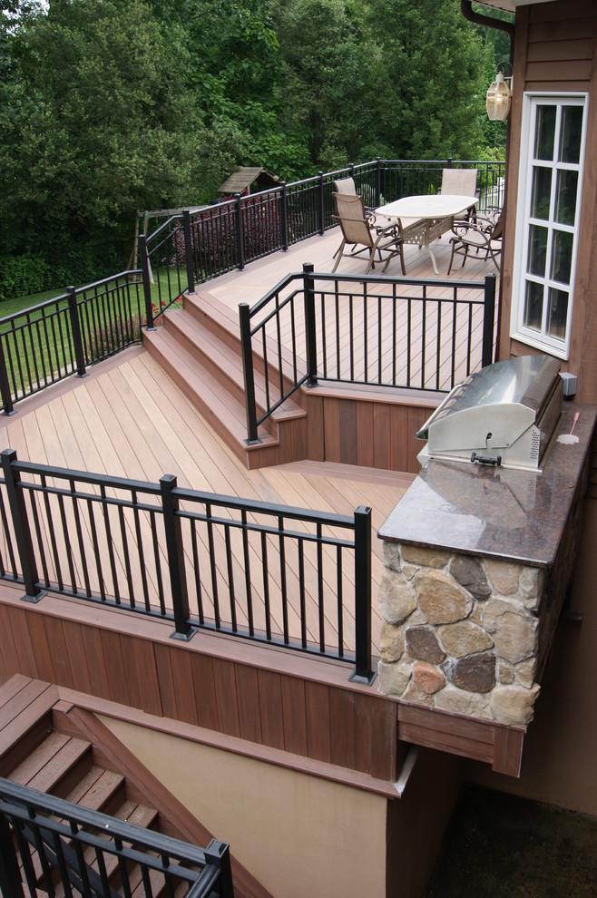 Inspiration for a large traditional backyard deck in New York with an outdoor kitchen and no cover.