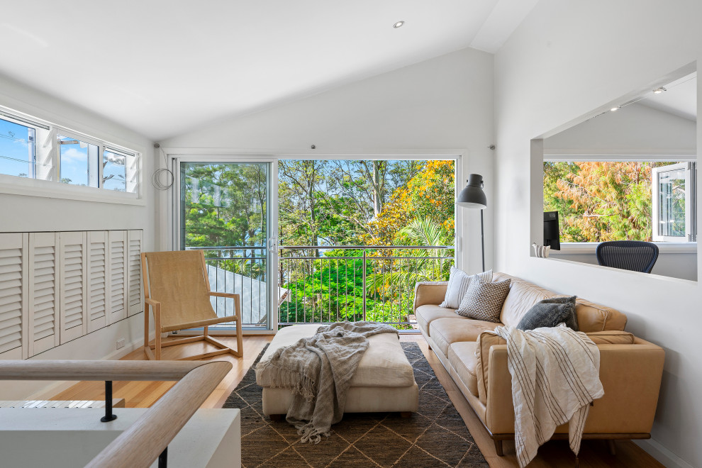 Design ideas for a beach style family room in Sydney.