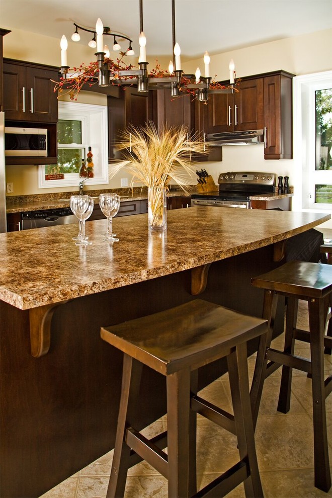 Inspiration for a transitional ceramic tile kitchen remodel in Toronto with shaker cabinets, medium tone wood cabinets, granite countertops, stainless steel appliances and an island