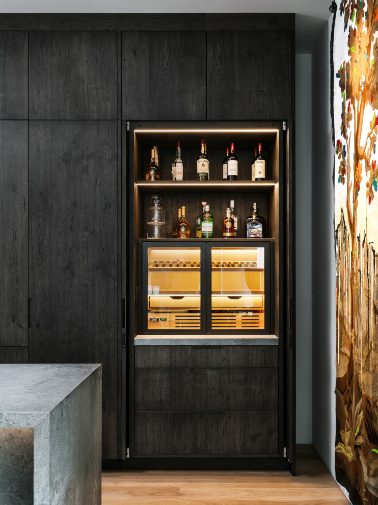 Example of a trendy home bar design in Austin