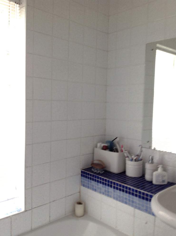 Small bathroom with med grey tiles