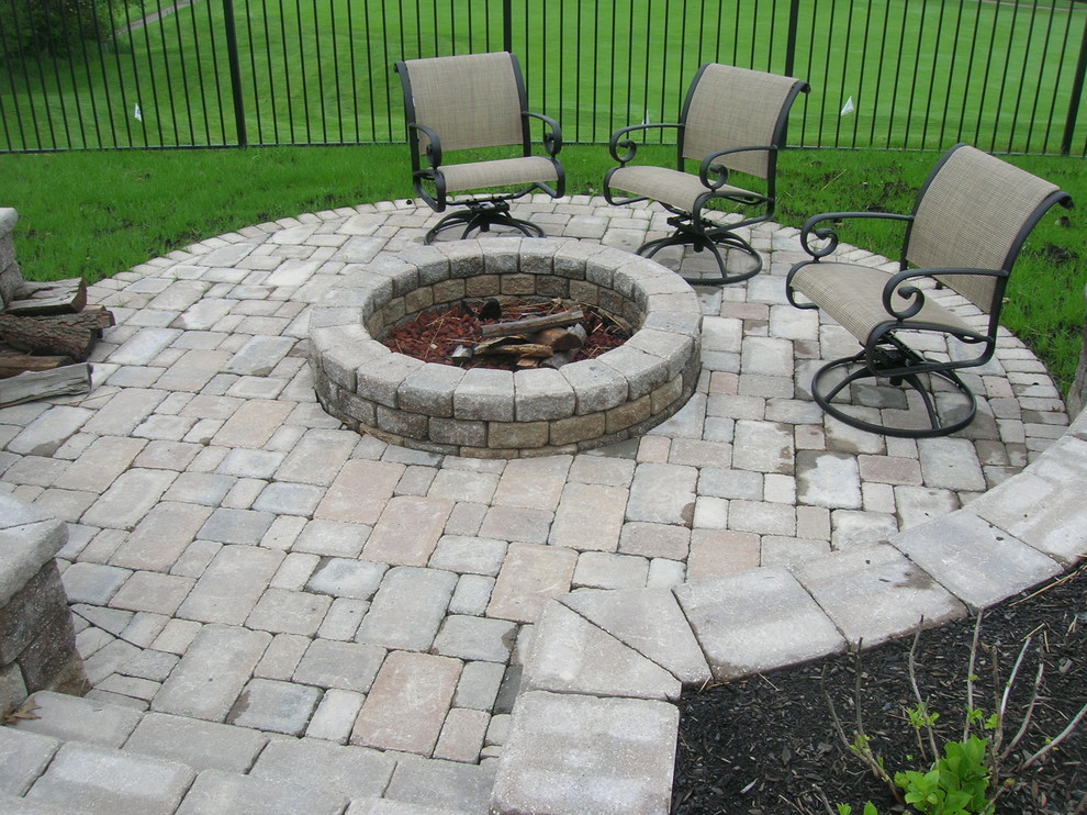 Patio - mid-sized transitional backyard concrete paver patio idea with a fire pit