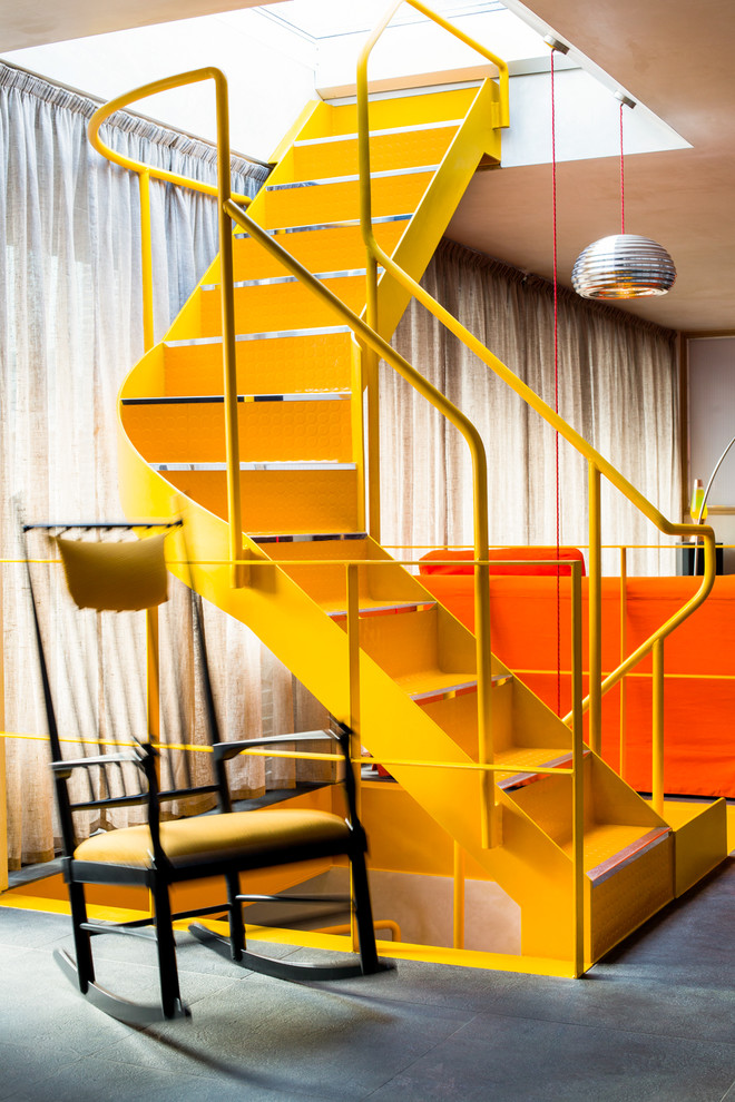 Inspiration for a contemporary metal floating staircase in London with metal risers and metal railing.