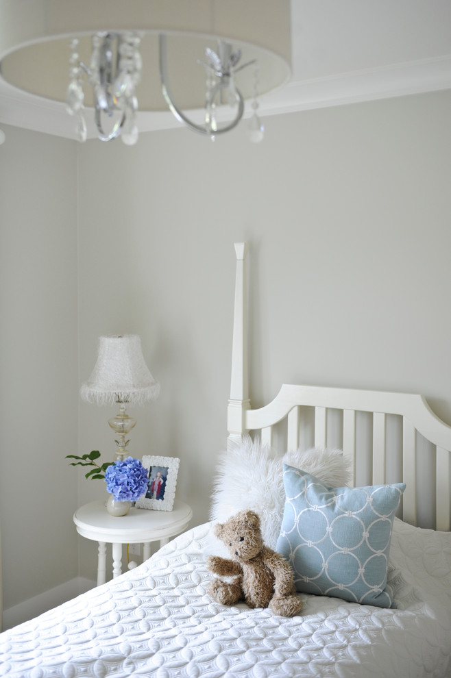 Design ideas for a mid-sized arts and crafts kids' bedroom for girls and kids 4-10 years old in Vancouver with grey walls.