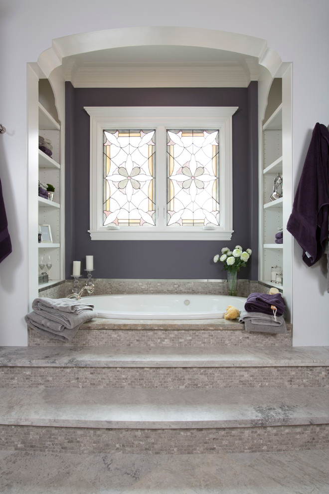Drop-in bathtub - large traditional marble floor, brown floor and single-sink drop-in bathtub idea in Houston with recessed-panel cabinets, brown cabinets, an undermount sink, a built-in vanity and purple walls