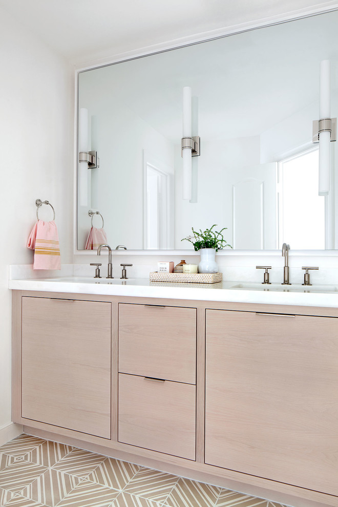 Mid-sized transitional beige floor bathroom photo in DC Metro with light wood cabinets, white walls, marble countertops, white countertops and an undermount sink