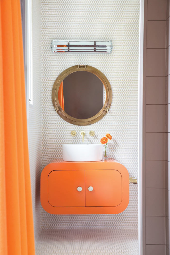 Photo of a small contemporary 3/4 bathroom in Cleveland with flat-panel cabinets, orange cabinets, white tile, white walls, a vessel sink, solid surface benchtops, white floor and orange benchtops.