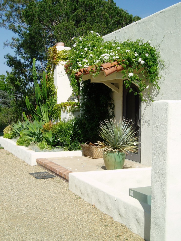 Inspiration for a mediterranean front door in San Diego with a single front door and white walls.
