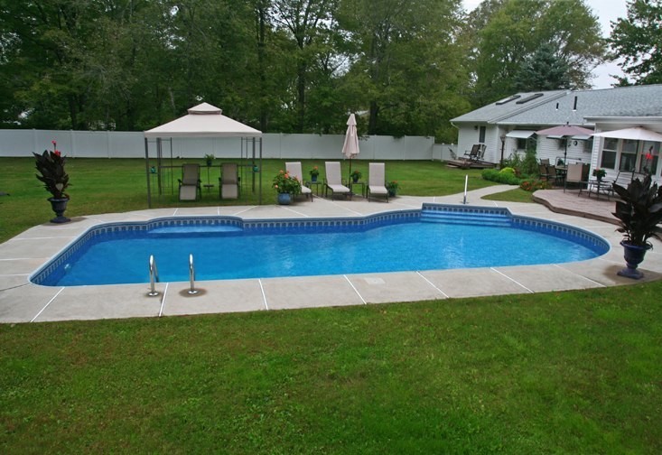 Pool - concrete and custom-shaped pool idea in Boston