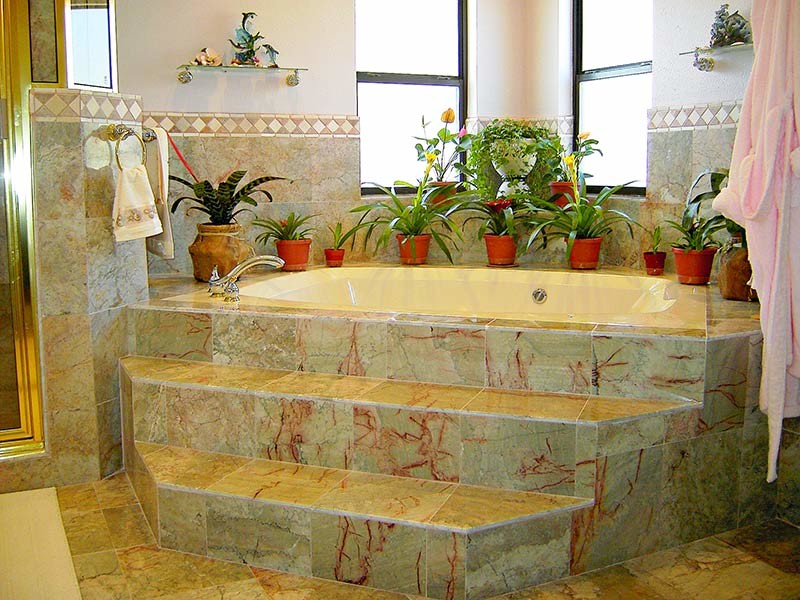 Inspiration for a transitional corner bathtub remodel in Austin with white walls