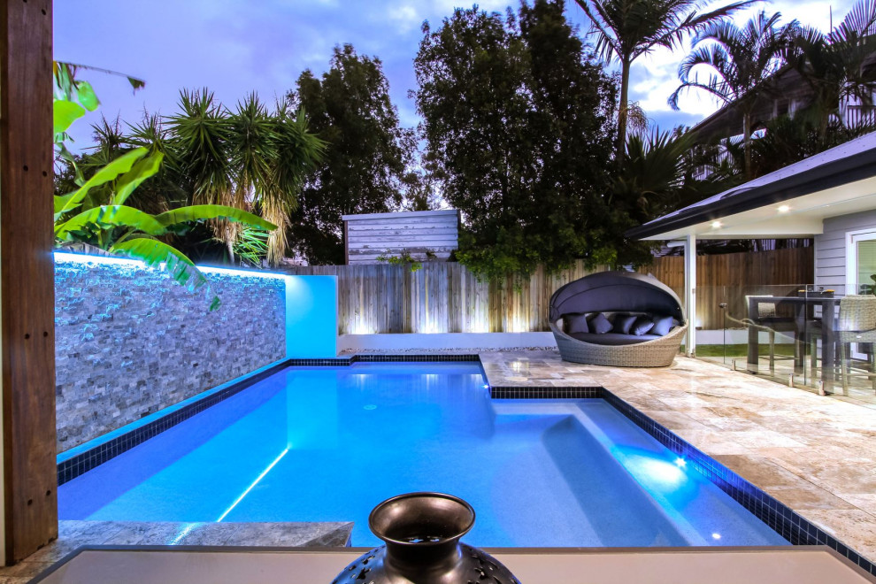 Inspiration for a mid-sized modern backyard custom-shaped pool in Brisbane with with a pool and tile.