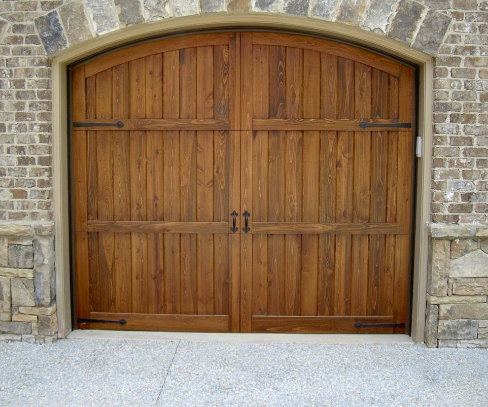 Example of a mountain style one-car garage design in Atlanta