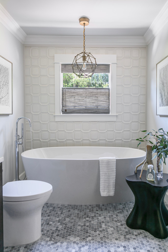 Design ideas for a transitional master bathroom in San Francisco with a freestanding tub, a one-piece toilet, ceramic tile, grey walls, marble floors, grey floor and white tile.