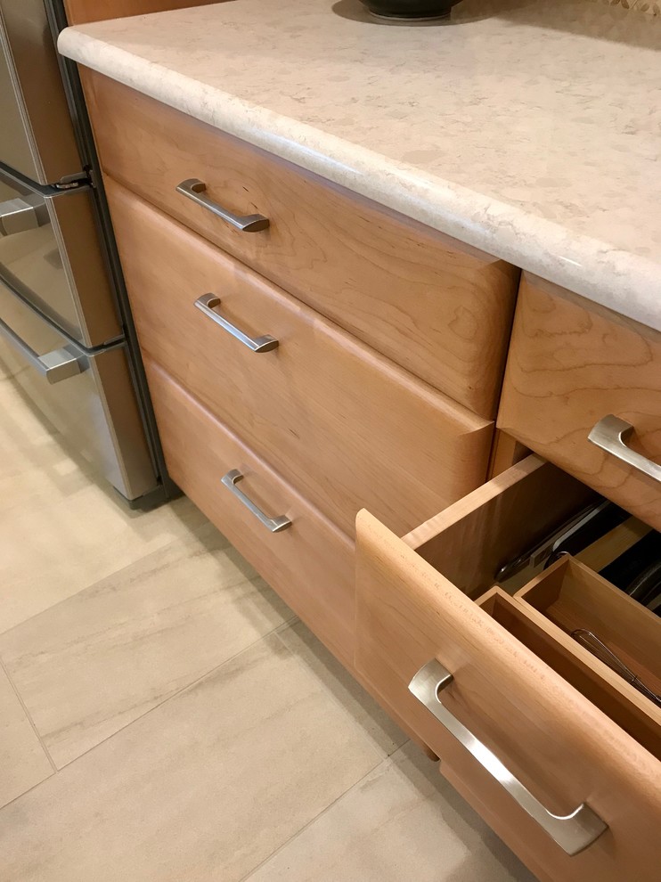 Example of a large trendy kitchen design in Detroit with quartz countertops, multicolored backsplash, an island and beige countertops