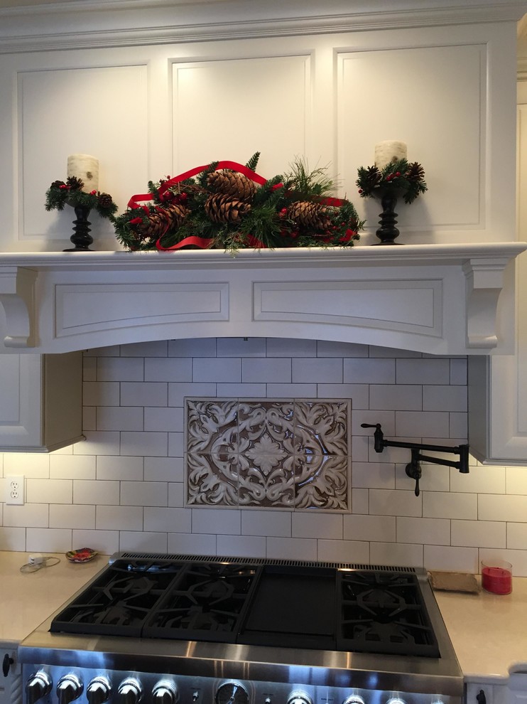 Eat-in kitchen - large transitional u-shaped dark wood floor eat-in kitchen idea in Indianapolis with an undermount sink, raised-panel cabinets, white cabinets, quartz countertops, white backsplash, subway tile backsplash, stainless steel appliances and an island