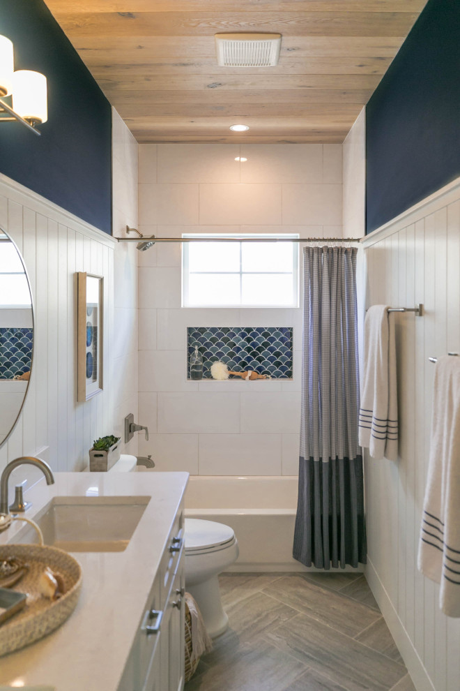 This is an example of a bathroom in Jacksonville with white cabinets, a built-in bath, white walls, wood-effect flooring, engineered stone worktops, white worktops, a wood ceiling and wainscoting.