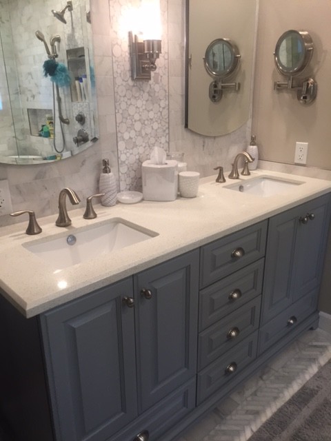 Design ideas for a mid-sized country master bathroom in San Francisco with raised-panel cabinets, white cabinets, a claw-foot tub, an alcove shower, a one-piece toilet, white tile, matchstick tile, white walls, light hardwood floors, an integrated sink and granite benchtops.