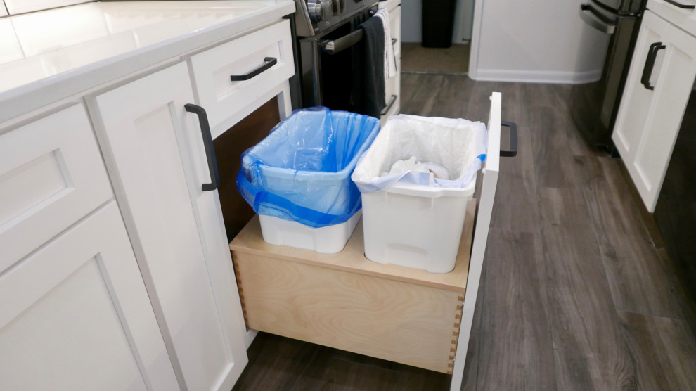 Mid-sized transitional galley porcelain tile and gray floor eat-in kitchen photo with an undermount sink, shaker cabinets, white cabinets, quartz countertops, white backsplash, subway tile backsplash, black appliances, no island and white countertops