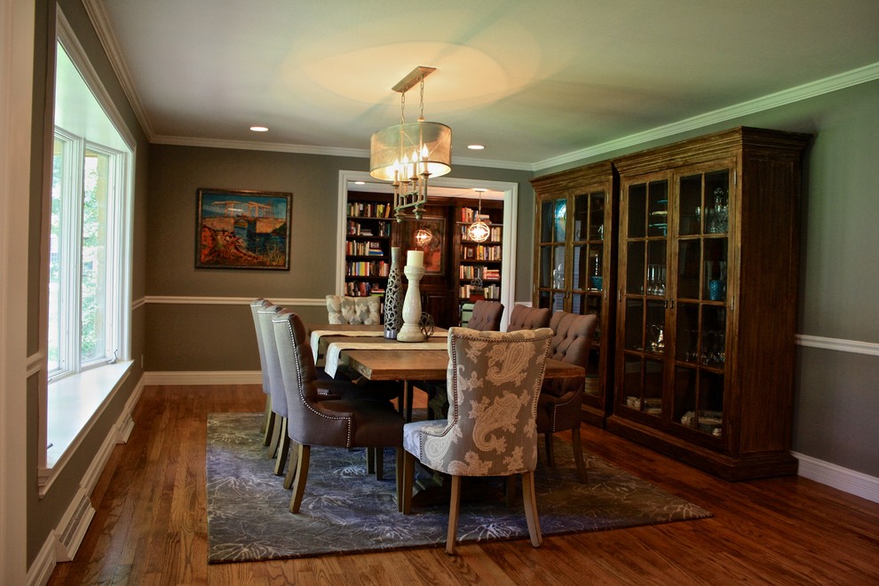 Large transitional separate dining room in St Louis with grey walls and medium hardwood floors.