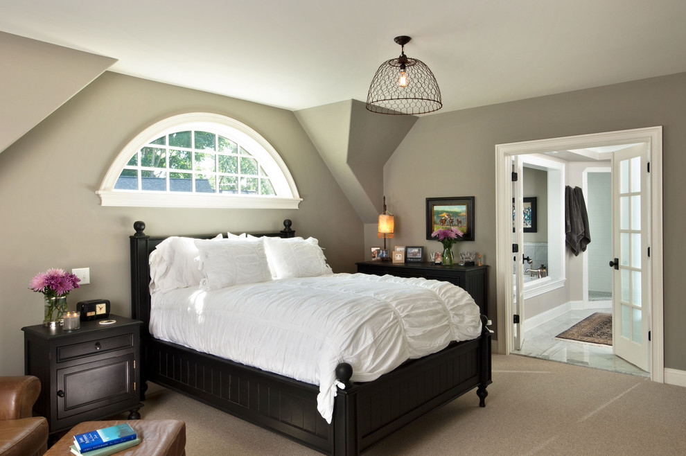 This is an example of a traditional bedroom in New York with grey walls and carpet.