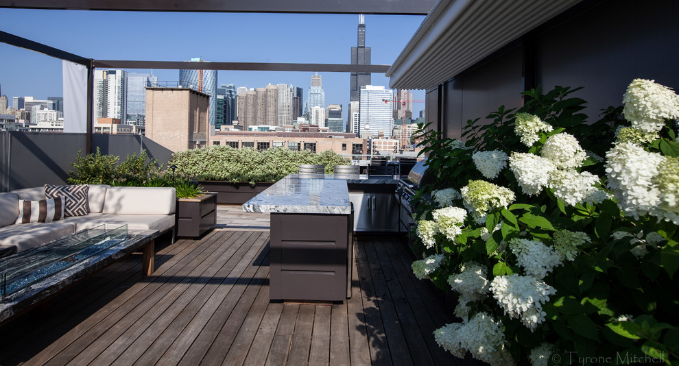 Inspiration for a modern rooftop deck remodel in Chicago with a fire pit
