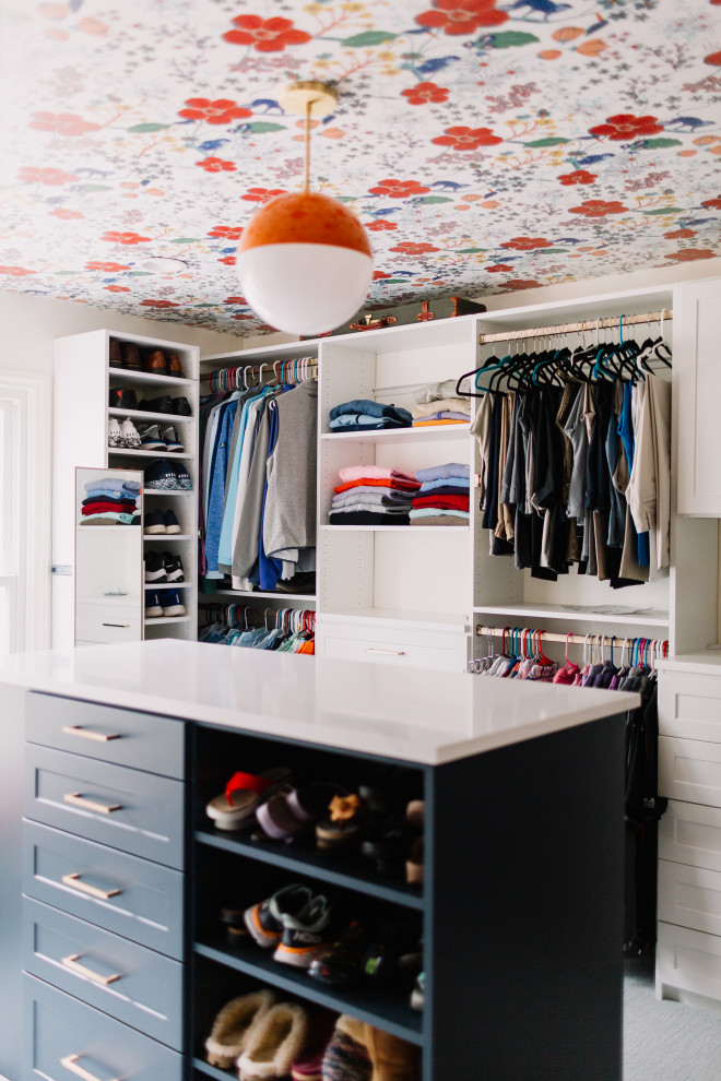 Design ideas for a mid-sized eclectic walk-in wardrobe in Dallas with open cabinets, blue cabinets and wallpaper.