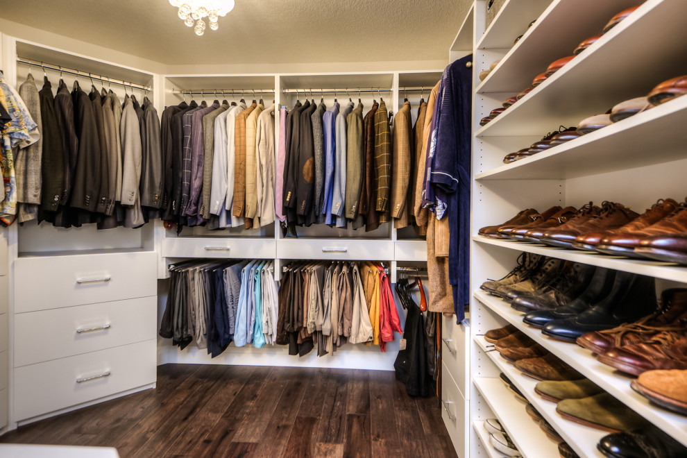 Photo of a large contemporary walk-in wardrobe in Toronto with white cabinets, dark hardwood floors and brown floor.